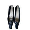 Black leather shoes with pointed front