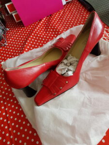 Melia Red Office shoes with black heels and semi-pointed front.